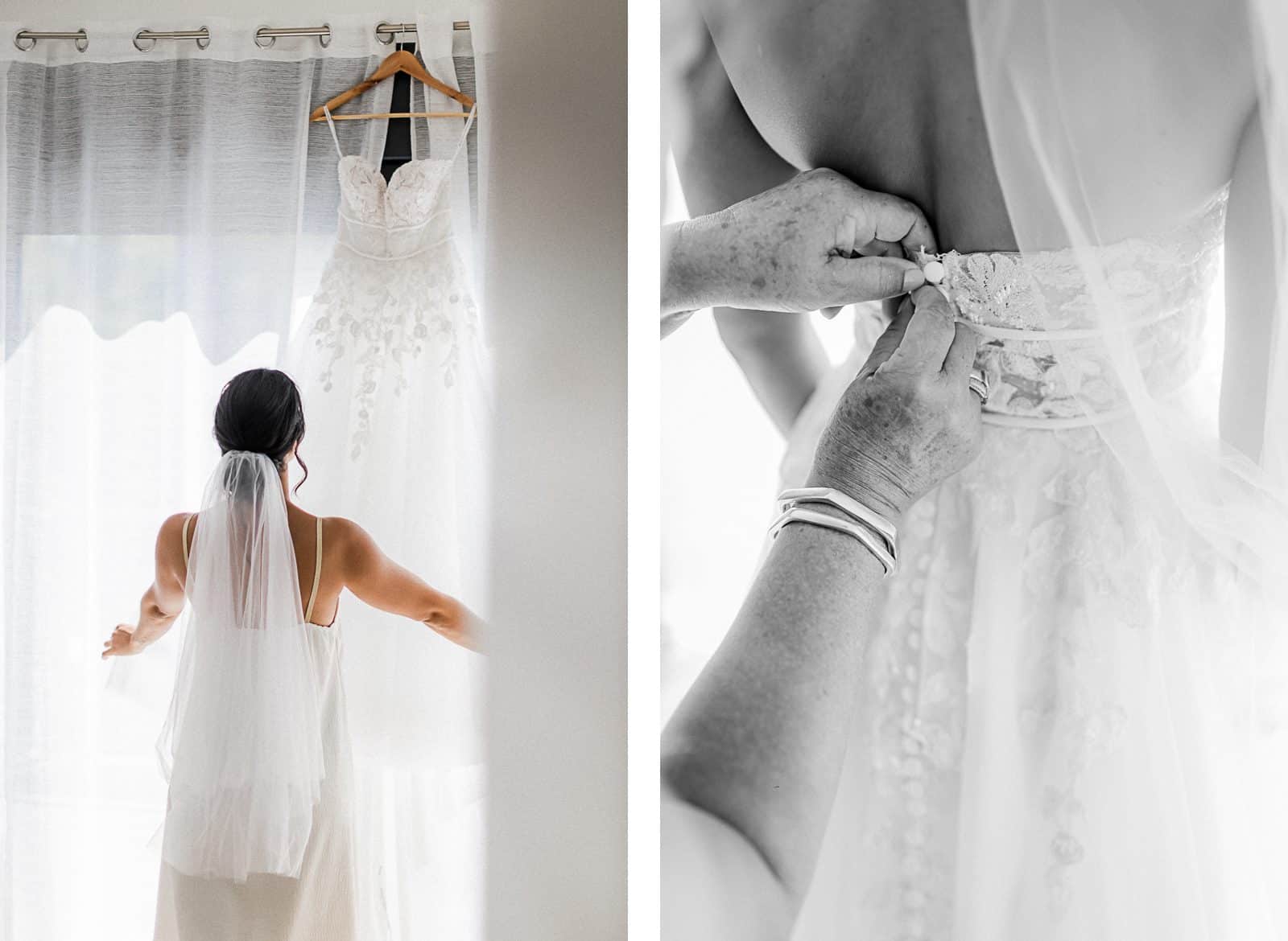 Photographie de Mathieu Dété, photographe de mariage et famille à Saint-Denis sur l'île de la Réunion 974, présentant la mariée qui regarde sa robe accrochée à la fenêtre